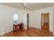Bright bedroom with hardwood floors, a ceiling fan, and a closet at 4710 Hinesley Ave, Indianapolis, IN 46208