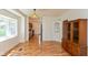 Sunlit dining room showcases hardwood floors and a vintage hutch at 4710 Hinesley Ave, Indianapolis, IN 46208