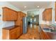 Well-lit kitchen with stainless steel appliances, wood countertop, and hardwood flooring at 4710 Hinesley Ave, Indianapolis, IN 46208