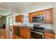 Modern kitchen featuring stainless steel appliances, wooden counters, and hardwood floors at 4710 Hinesley Ave, Indianapolis, IN 46208