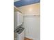 Laundry nook with stacked washer and dryer at 4710 Hinesley Ave, Indianapolis, IN 46208