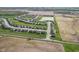 A beautiful aerial view of a new neighborhood with pond and green space at 4985 W Burrel Ln, New Palestine, IN 46163