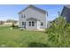 This backyard boasts plenty of healthy grass and minimal, thoughtfully arranged landscaping at 4985 W Burrel Ln, New Palestine, IN 46163