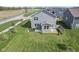 Aerial shot of a backyard featuring lush green grass, patio and landscaping at 4985 W Burrel Ln, New Palestine, IN 46163