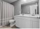 Bright bathroom featuring a double vanity with modern fixtures and a shower-tub combination at 4985 W Burrel Ln, New Palestine, IN 46163