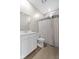 Clean bathroom design featuring a vanity, toilet, and a tiled shower with a patterned shower curtain at 4985 W Burrel Ln, New Palestine, IN 46163