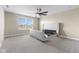 Bright bedroom featuring a large window, ceiling fan, and stylish, modern frame for the new owners to enjoy at 4985 W Burrel Ln, New Palestine, IN 46163