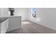 Bright bedroom features a window with natural light and sleek white shiplap walls at 4985 W Burrel Ln, New Palestine, IN 46163