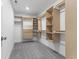 Walk-in closet with custom shelving and drawers to maximize space and organization at 4985 W Burrel Ln, New Palestine, IN 46163