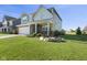Attractive home exterior featuring a well-manicured lawn and a two-car garage at 4985 W Burrel Ln, New Palestine, IN 46163