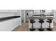 Modern kitchen featuring stainless steel appliances, granite counters, and barstool seating at 4985 W Burrel Ln, New Palestine, IN 46163