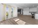 Open floor plan with sliding glass doors leading to an extended view of the kitchen area at 4985 W Burrel Ln, New Palestine, IN 46163