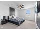 Stylishly decorated main bedroom featuring a modern ceiling fan and a striking accent wall at 4985 W Burrel Ln, New Palestine, IN 46163