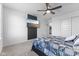 Comfortable main bedroom boasting a modern ceiling fan and television for relaxation at 4985 W Burrel Ln, New Palestine, IN 46163