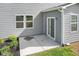 Cozy backyard patio with a sliding door and fresh landscaping at 4985 W Burrel Ln, New Palestine, IN 46163