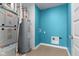 The utility room features modern mechanicals with a colorful blue painted accent wall at 4985 W Burrel Ln, New Palestine, IN 46163