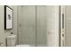 Modern bathroom with a tiled walk-in shower and glass enclosure at 5308 W Glenview Dr, McCordsville, IN 46055