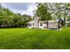 Expansive backyard with mature trees, patio, and well-manicured lawn at 5450 Fenmore Rd, Indianapolis, IN 46228