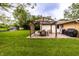 Spacious backyard with a pergola covered patio, garden, and shed, great for outdoor gatherings at 5450 Fenmore Rd, Indianapolis, IN 46228