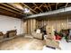 Unfinished basement space ready for customization with exposed ceiling and cement floor at 5450 Fenmore Rd, Indianapolis, IN 46228