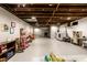 Spacious unfinished basement featuring an open layout with visible ceiling and playful decor at 5450 Fenmore Rd, Indianapolis, IN 46228