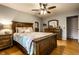 Comfortable bedroom with hardwood floors and a wooden bed, perfect for relaxation at 5450 Fenmore Rd, Indianapolis, IN 46228