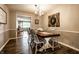 Elegant dining room featuring a stylish chandelier and plenty of seating for guests at 5450 Fenmore Rd, Indianapolis, IN 46228