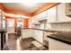 Updated kitchen featuring white cabinets, stainless steel appliances, and dark countertops at 5450 Fenmore Rd, Indianapolis, IN 46228