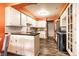Bright kitchen with white cabinetry, stainless steel appliances, and hardwood floors at 5450 Fenmore Rd, Indianapolis, IN 46228