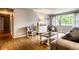 Bright living room with hardwood floors and neutral-toned decor and furniture at 5450 Fenmore Rd, Indianapolis, IN 46228