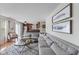 Open-concept living area with a comfortable sofa and easy access to the kitchen at 5550 Sweet River Dr, Indianapolis, IN 46221