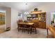 Traditional dining room featuring a wooden dining table, carpeted floors and hutch at 5615 Burning Tree Ct, Indianapolis, IN 46239
