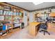 Home office with built-in bookshelves, desk, and cabinets for optimal organization and storage at 5615 Burning Tree Ct, Indianapolis, IN 46239