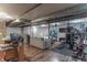 Spacious finished basement perfect for recreation, equipped with exercise equipment and comfortable seating at 5901 W Thompson Rd, Indianapolis, IN 46221