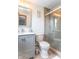 Modern bathroom with a glass-enclosed shower, stylish vanity, and updated fixtures at 5901 W Thompson Rd, Indianapolis, IN 46221