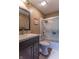 Cozy bathroom with a shower/tub combination, sleek glass doors, and elegant countertops at 5901 W Thompson Rd, Indianapolis, IN 46221