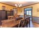 Spacious dining room featuring a large wooden table and seating for eight, great for entertaining at 5901 W Thompson Rd, Indianapolis, IN 46221