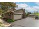 Spacious three-car garage with extra parking and a well-maintained driveway in a suburban setting at 5901 W Thompson Rd, Indianapolis, IN 46221