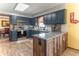 Charming kitchen featuring stainless steel appliances, a breakfast bar, and subway tile backsplash at 5901 W Thompson Rd, Indianapolis, IN 46221