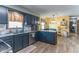 Well-appointed kitchen with updated appliances, ample counter space, and stylish cabinetry at 5901 W Thompson Rd, Indianapolis, IN 46221