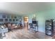 Spacious living room with a modern decor, comfortable seating, and a dedicated workstation at 5901 W Thompson Rd, Indianapolis, IN 46221