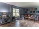 Inviting living room with a large sectional sofa, stylish decor, and ample natural light at 5901 W Thompson Rd, Indianapolis, IN 46221