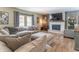 Cozy living room with a fireplace, plush seating, and warm lighting perfect for relaxing at 5901 W Thompson Rd, Indianapolis, IN 46221