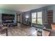 Cozy living room filled with natural light featuring wood floors and comfortable seating at 5901 W Thompson Rd, Indianapolis, IN 46221