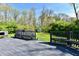 Backyard featuring a large deck with built-in seating overlooking a lush lawn at 609 Delray Dr, Indianapolis, IN 46241