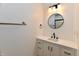 Bathroom showcasing a sink and modern faucet with a sleek mirror and towel rack at 609 Delray Dr, Indianapolis, IN 46241