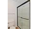 Modern bathroom with glass shower, toilet, and neutral color scheme at 609 Delray Dr, Indianapolis, IN 46241