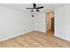 Spacious bedroom with hardwood floors and ceiling fan, offering ample natural light at 609 Delray Dr, Indianapolis, IN 46241