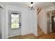 Welcoming entryway featuring a stylish front door and staircase, creating a grand first impression at 609 Delray Dr, Indianapolis, IN 46241