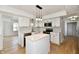 Stylish kitchen featuring an island, stainless steel appliances, and pendant lighting at 609 Delray Dr, Indianapolis, IN 46241